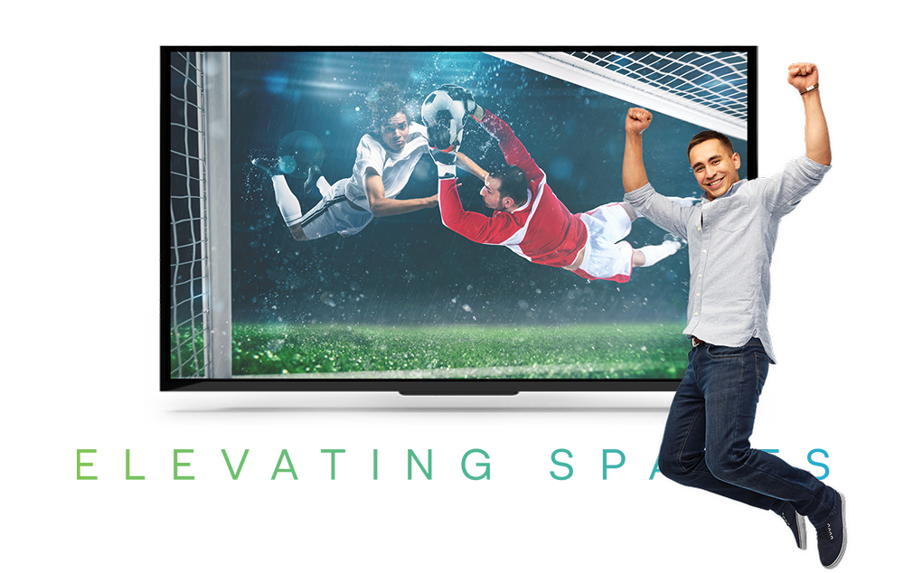 A wide LED screen showing live football in a hospitality venue