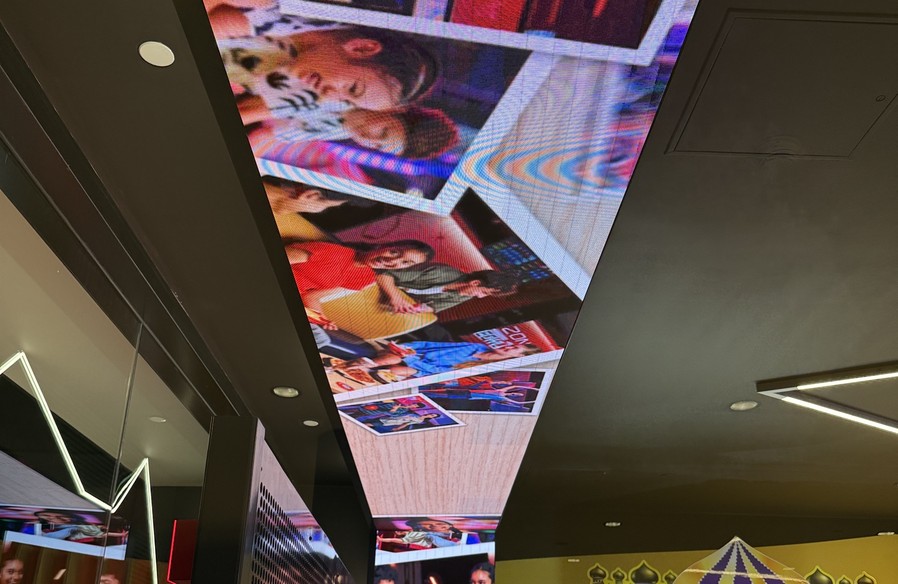 LED ceiling and column wrap at the Timezone entrance running full-colour content